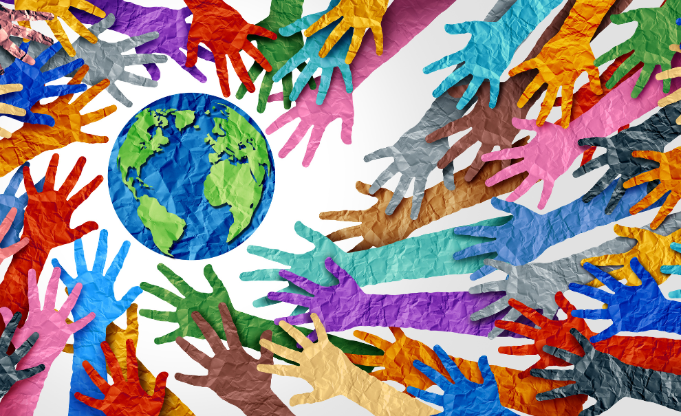 Paper art depicting many hands of several colors reaching towards planet Earth.